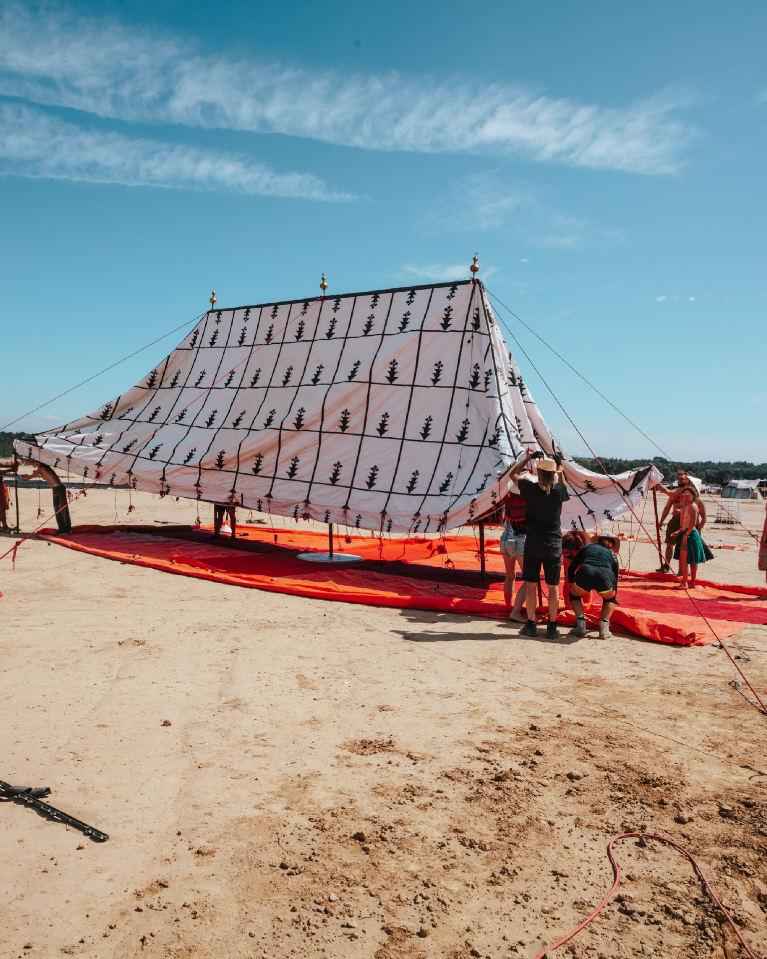 The patterned camp structure during construction in the desert
